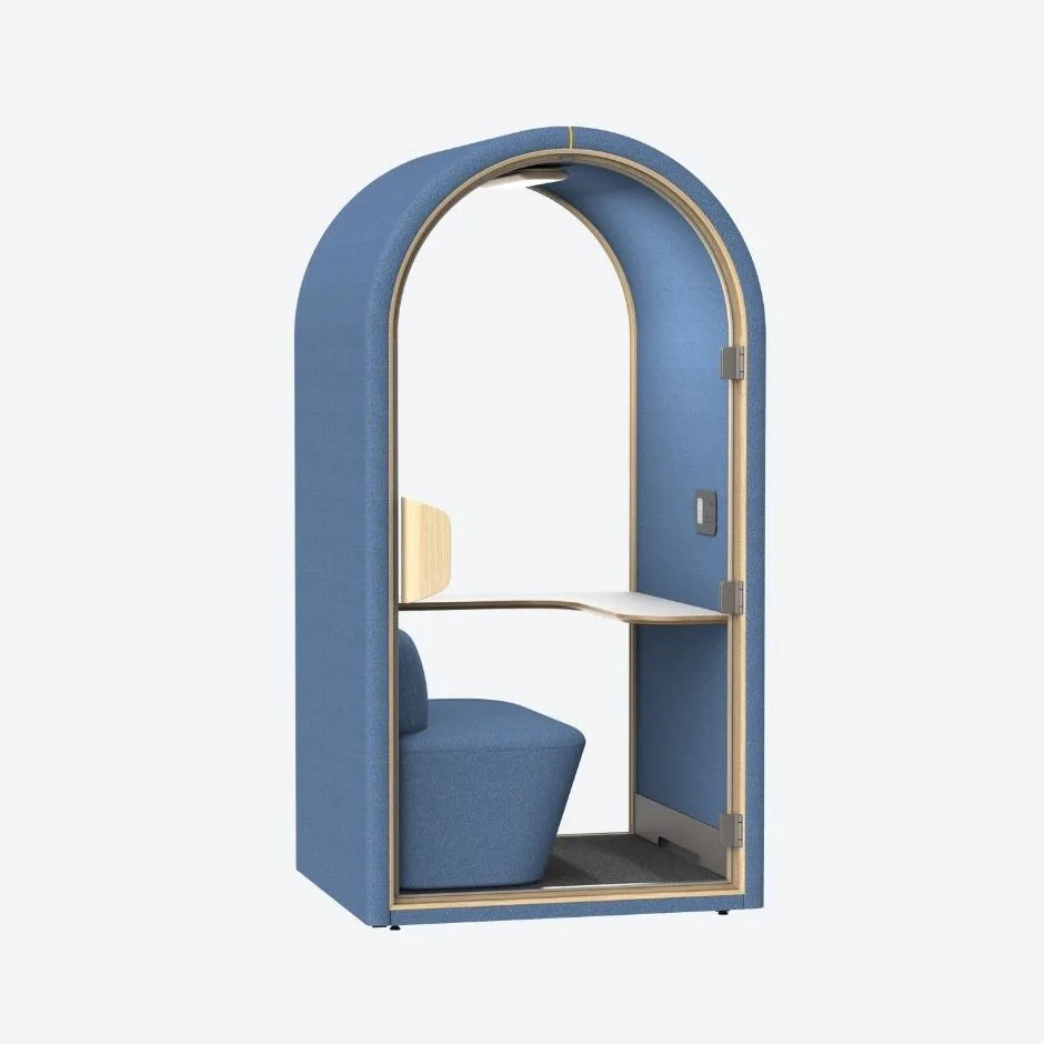 Blue acoustic pod with soft curved design, built-in seat and work desk β ideal for quiet focus in open-plan workspaces.