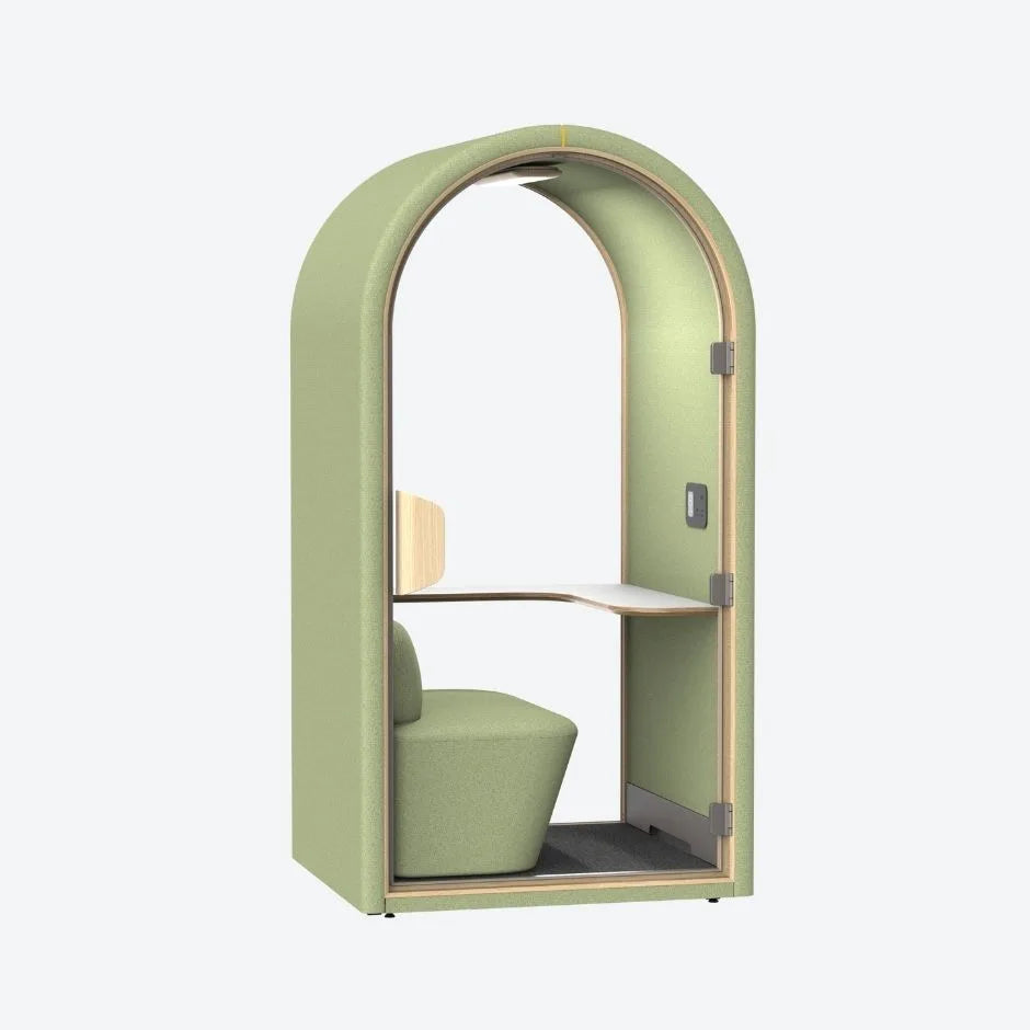 Green acoustic pod with soft curved design, built-in seat and work desk β ideal for quiet focus in open-plan workspaces.